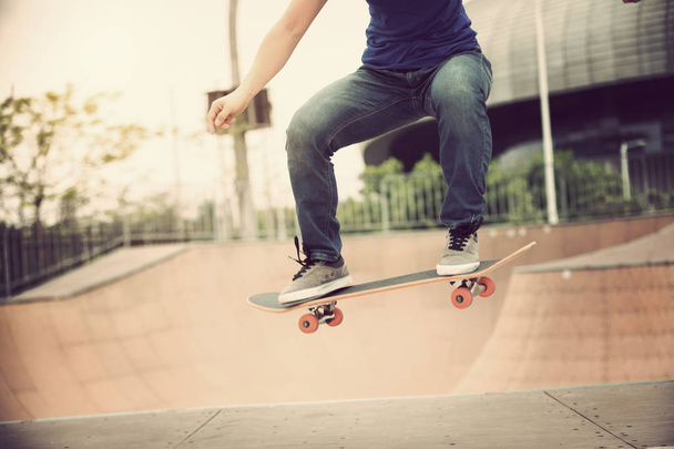 Cropped image of Skateboarder on skatepark ramp - Fotó, kép