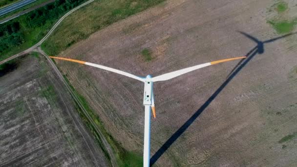 Aerial view on spinning blades of wind turbine tower on wheat field - Footage, Video