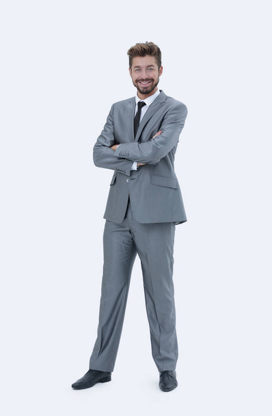 Full length of a young caucasian businessman with arms folded - Фото, изображение