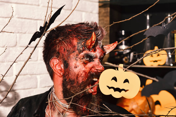 Halloween costume party concept. Man wearing scary makeup - Foto, imagen
