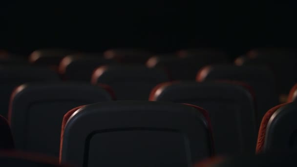 Empty comfortable seats in cinema. Theatre hall with empty armchairs - Footage, Video