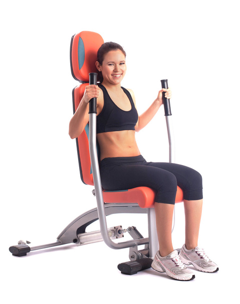 Athletic woman on modern gym trainer - Foto, afbeelding
