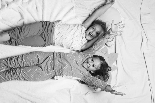 Schoolgirls have pajama party with funny pillows - Foto, immagini