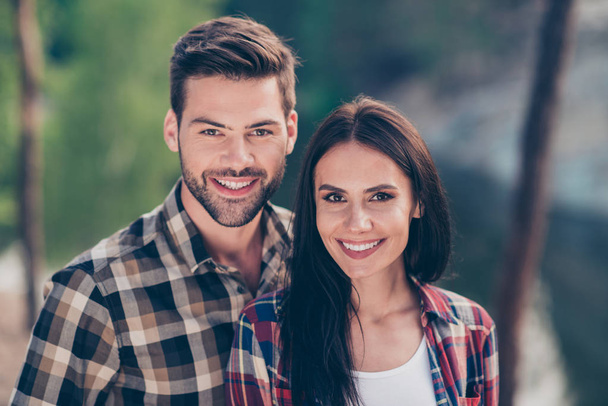 Portrait of nice lovely couple, spouses wearing casual checkered - Foto, Imagem
