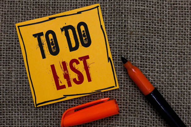 Conceptual hand writing showing To Do List. Business photo showcasing A structure that usualy made in paper contining task of yours Orange paper Marker Communicate ideas Jute background - Photo, image
