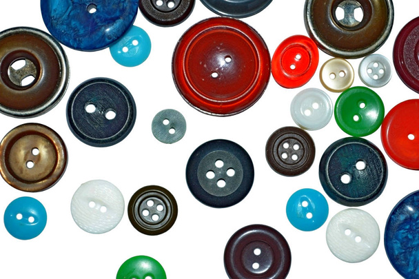 абстрактний фон з кольоровими кнопками для одягу на білому тлі
 - Фото, зображення