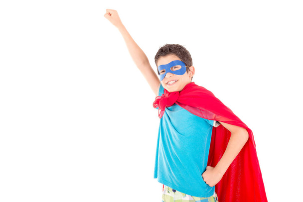 little boy pretending to be a superhero isolated on white background - Foto, Bild
