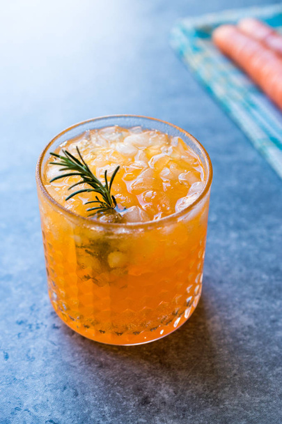 Carrot Cocktail with Crushed Ice and Rosemary. Beverage Concept. - Foto, Imagem