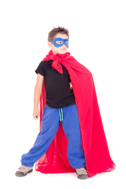 little boy pretending to be a super hero isolated on white - Fotó, kép