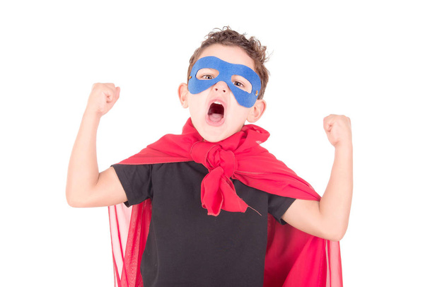 little boy pretending to be a super hero isolated on white - Foto, immagini