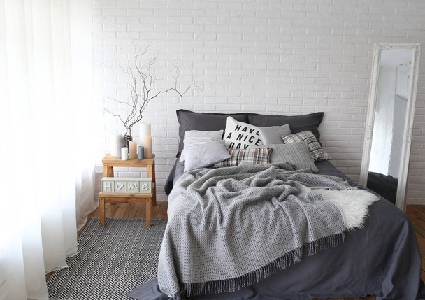 comfort interior of bedroom with bed in gray color - Foto, afbeelding