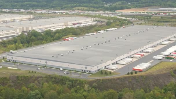 NEW YORK USA - SEPTEMBER 23: AERIAL Transportation and warehouse logistic center with worldwide supply chain offering delivery trucking services. Distribution network for shipping cargo and freight - Footage, Video