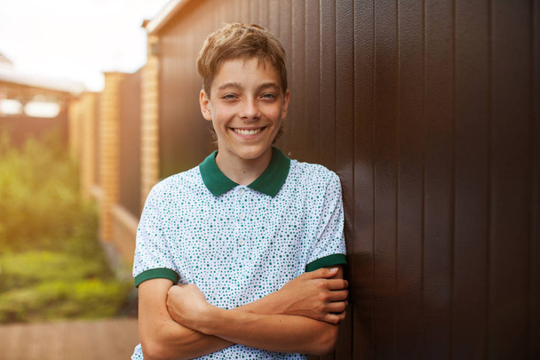 Smiling teen outdoors at summer. Happy one boy - Zdjęcie, obraz