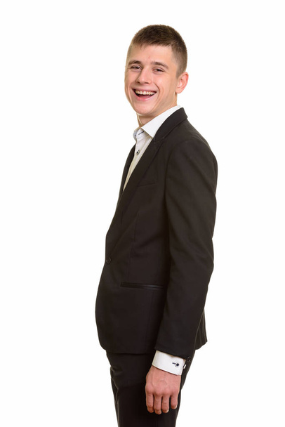 Studio shot of young happy businessman smiling - Фото, зображення