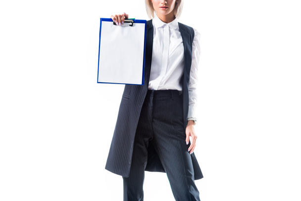 cropped shot of businesswoman in formal wear showing empty notepad isolated on white - Foto, imagen