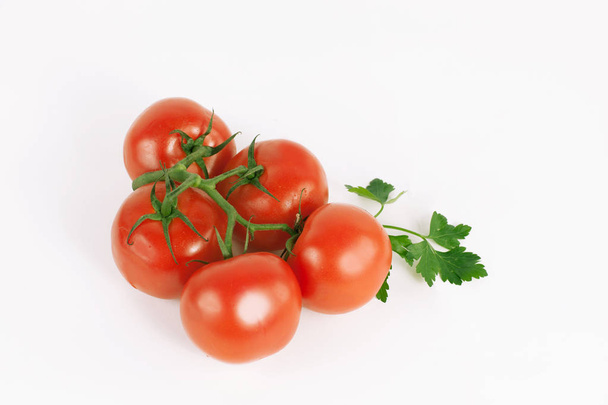 tomatoes on a branch .isolated white background - Фото, изображение