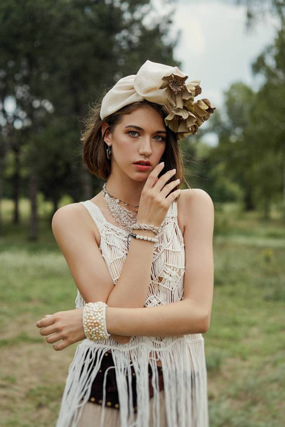 beautiful young fashion portrait of young woman in boho style clothing posing outdoors  - Foto, Bild