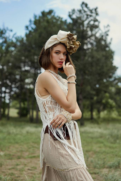 beautiful young fashion portrait of young woman in boho style clothing posing outdoors  - Foto, imagen