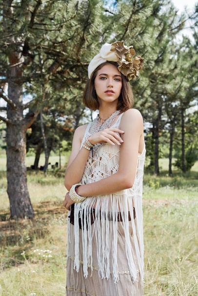 beautiful young fashion portrait of young woman in boho style clothing posing outdoors  - Foto, Bild