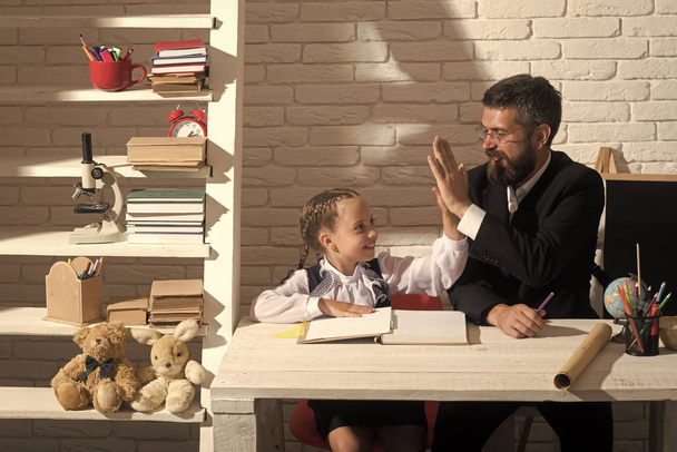 Back to school and fathers day concept. Girl and dad - Φωτογραφία, εικόνα