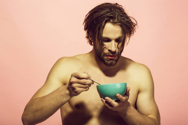 bearded naked sexy man has breakfast in the morning - 写真・画像