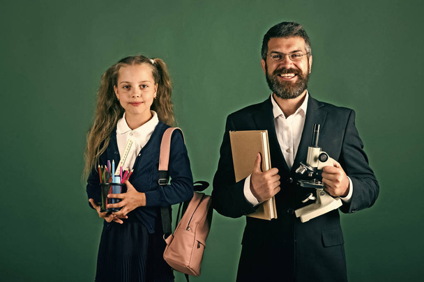 Girl and man in suit and school uniform - Foto, immagini