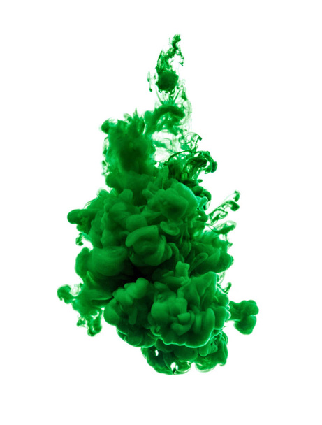 A drop of green paint dissolved in water. - Foto, Imagen