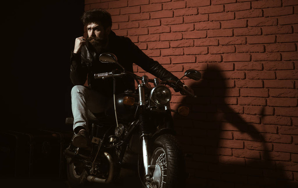 repair shop. bearded man biker in repair shop. repair shop or biker club. repair shop garage. bike is his life. - Fotoğraf, Görsel
