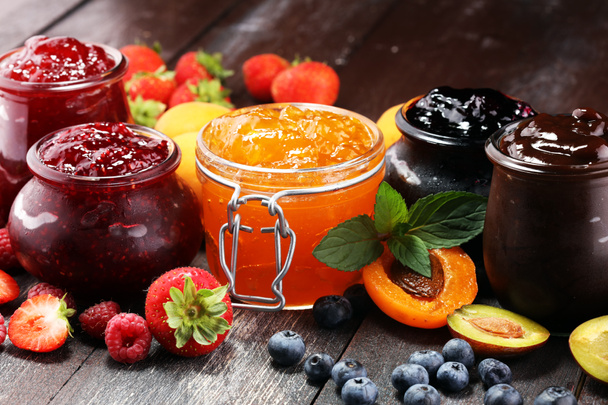 assortment of jams, seasonal berries, apricot, mint and fruits. marmalade or confiture - Photo, Image