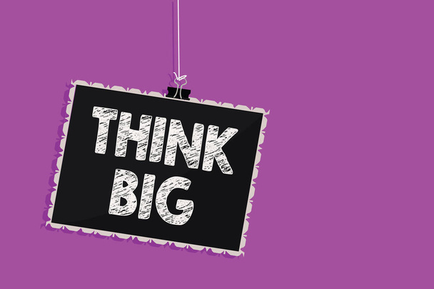 Text sign showing Think Big. Conceptual photo To plan for something high value for ones self or for preparation Hanging blackboard message communication information sign purple background - Photo, Image