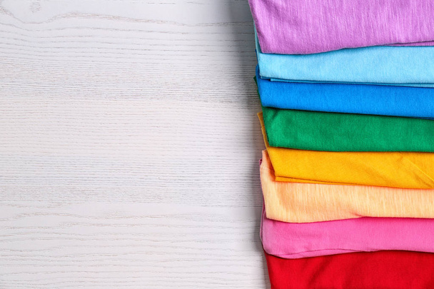 Colorful collection of  t-shirts on light background - Zdjęcie, obraz