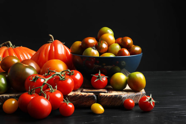 Composition with tasty juicy tomatoes on table - Fotoğraf, Görsel