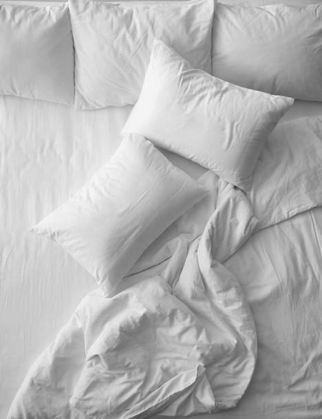 Soft pillows on comfortable bed, top view - Fotó, kép