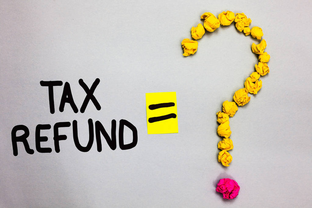 Conceptual hand writing showing Tax Refund. Business photo showcasing applied when money liability is less than the paid ones Crumpled forming question mark equal sign white background - Photo, Image