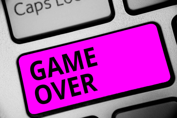 Writing note showing Game Over. Business photo showcasing A situation in a particular sport that reach his finals or ending Keyboard purple key Intention computer computing reflection document - Photo, Image