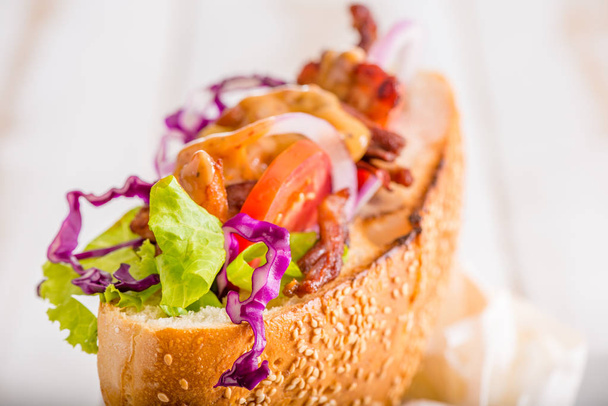 close up of Turkish kebab sandwich on white wooden background - Foto, Imagem