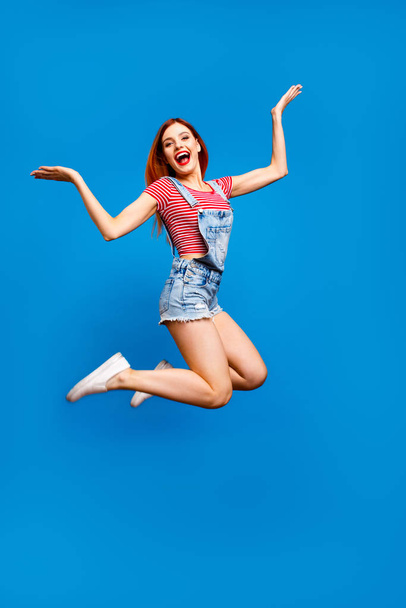 It party time! Emotion people person looking at camera concept. Vertical full body length size photo portrait of cheerful joyful pretty cool lady jumping up isolated bright color pastel background - Фото, зображення