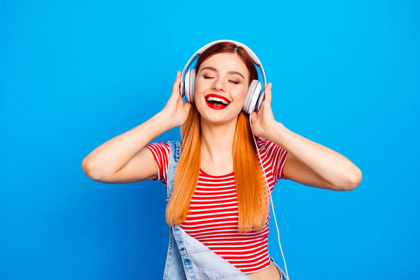 My favorite track! Close up photo portrait of positive optimistic with beaming toothy smile long hairstyle wearing white headset girl isolated bright vivid background - Foto, Imagem