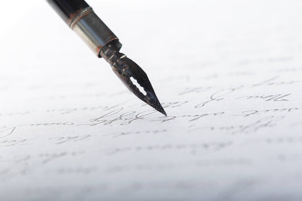 Fountain pen on antique handwritten letter, close-up  - Photo, Image