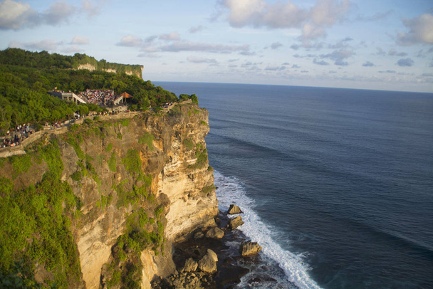 Uluwatu temple cliff, Indonesia. Uluwatu is a place on the south-western tip of the Bukit Peninsula of Bali, Indonesia. It is home to the Pura Luhur Uluwatu - Photo, Image