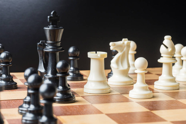 Chess pieces set on a chessboard - Fotografie, Obrázek