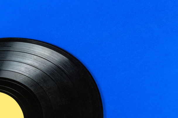 Retro vinyl record on blue background - Foto, immagini