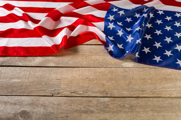 Bright American flag on wooden planks background - Foto, Bild