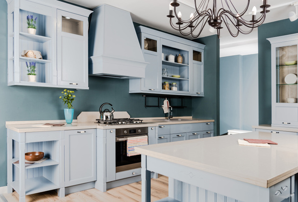 інтер'єр сучасної світлої кухні з білими дерев'яними меблями, горщиками і люстрою
 - Фото, зображення