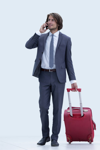 successful businessman with Luggage talking on the phone. - Zdjęcie, obraz