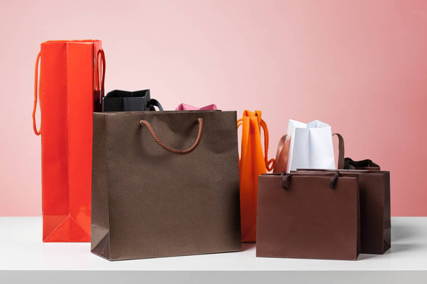 Shopping bags on color background - Fotoğraf, Görsel