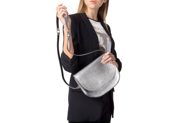 Woman holding a handbag isolated on white background - Foto, Imagen