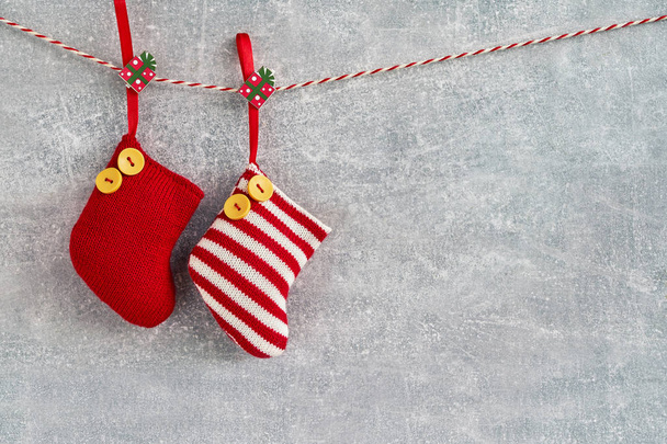 Christmas background. Red Christmas socks on gray background. Copy space. Christmas concept - Foto, Bild