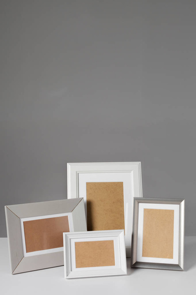 Blank photo frames on table - Fotoğraf, Görsel