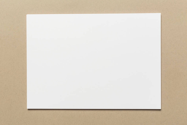 White business card on wooden table. Blank portrait A4. - Fotó, kép
